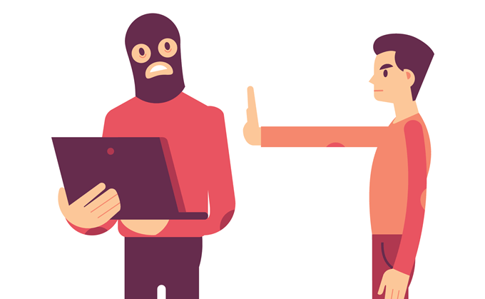 Image of a man preventing a thief from stealing his laptop